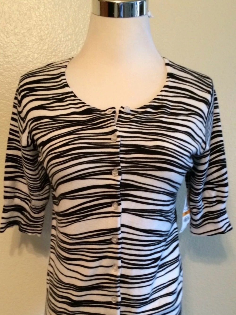 Cropped sweater. Very comfy. Perfect for wearing over long sleeve shirt